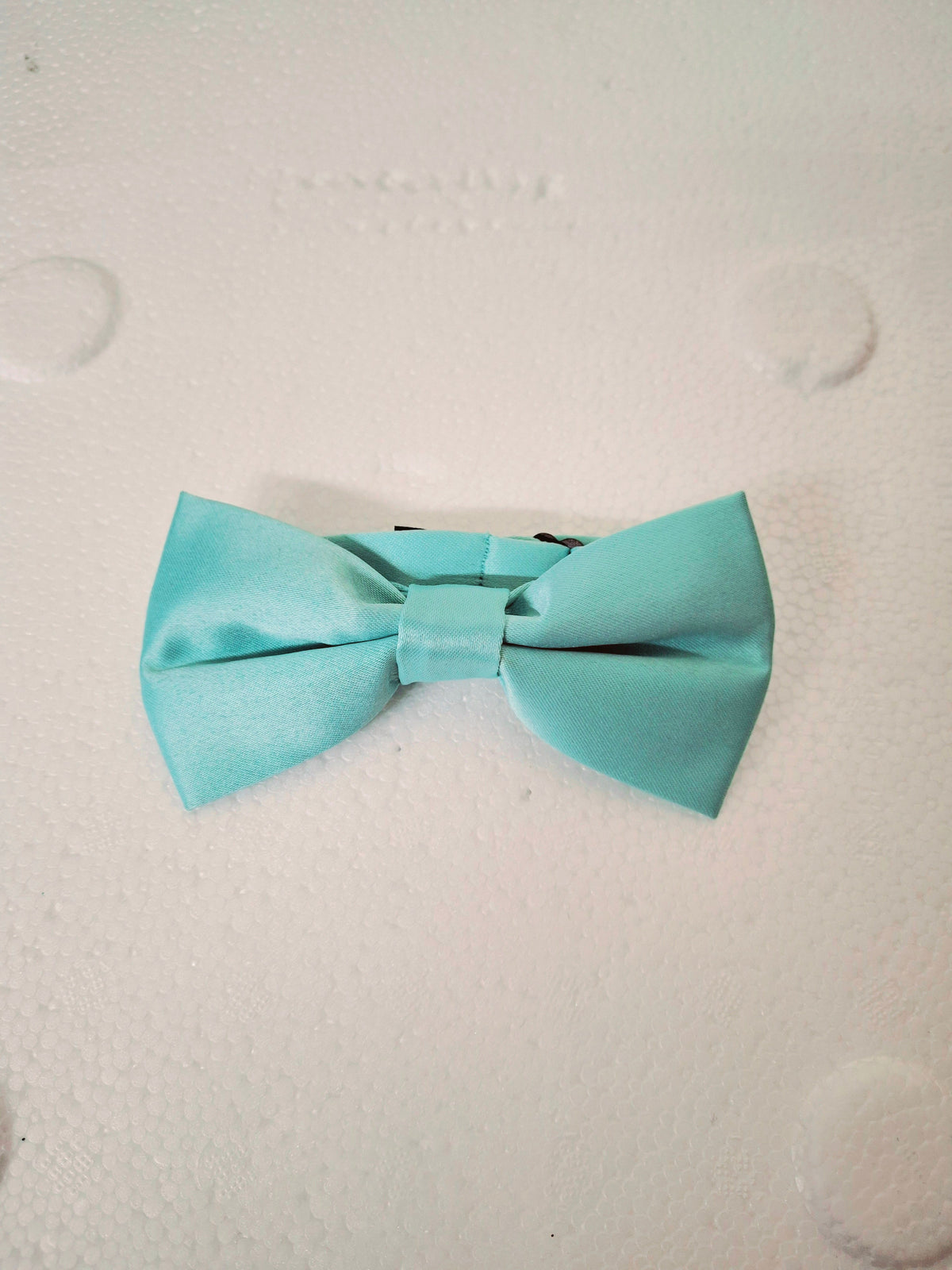 Adorable toddler wedding garment companion piece showing off the smooth texture of the Calla Collection BOWTIE BOY line