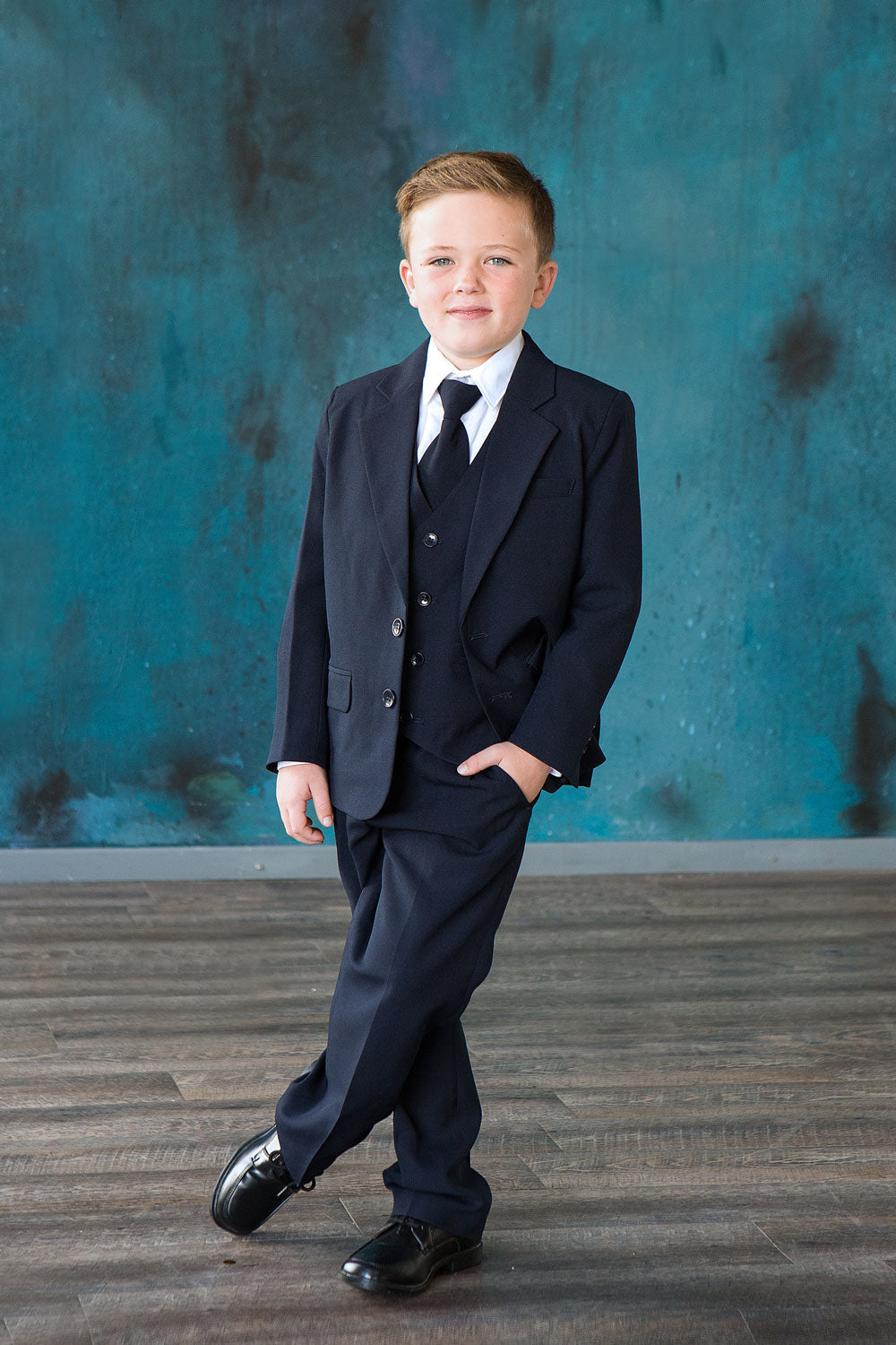 Dapper three-piece suit presentation including jacket vest and matching neckwear from the Calla Collection S-5003 line