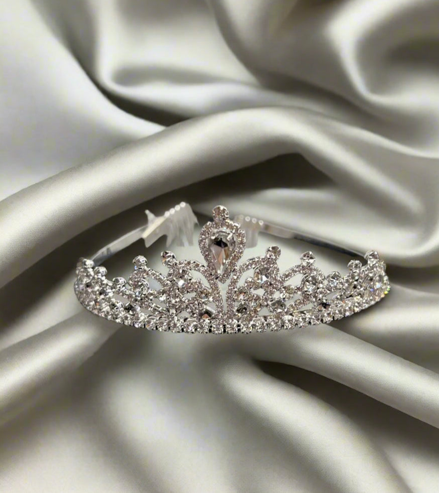 Silver jewelry piece from Calla Collection, showcasing intricate design and craftsmanship in a close-up shot.