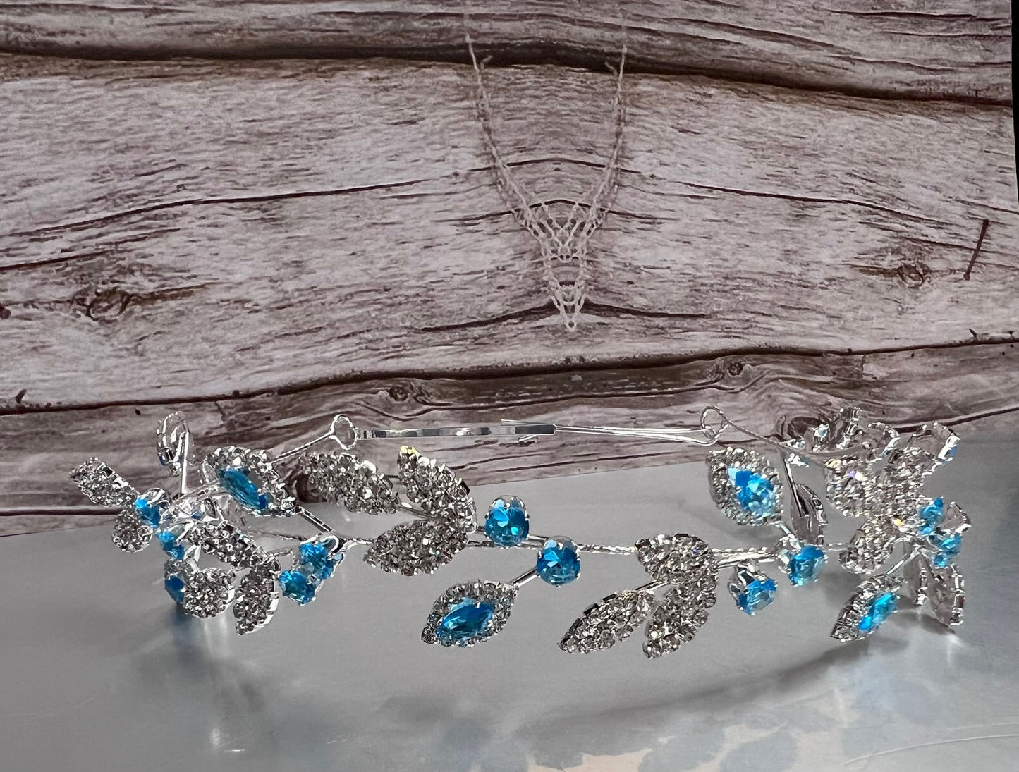 Calla Collection turquoise jewelry piece, showcasing intricate details and vibrant blue-green color in a close-up shot.