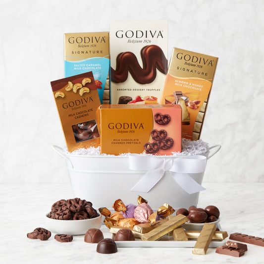 Godiva premium chocolate gift basket with assorted chocolates and treats, presented in a decorative gift basket.