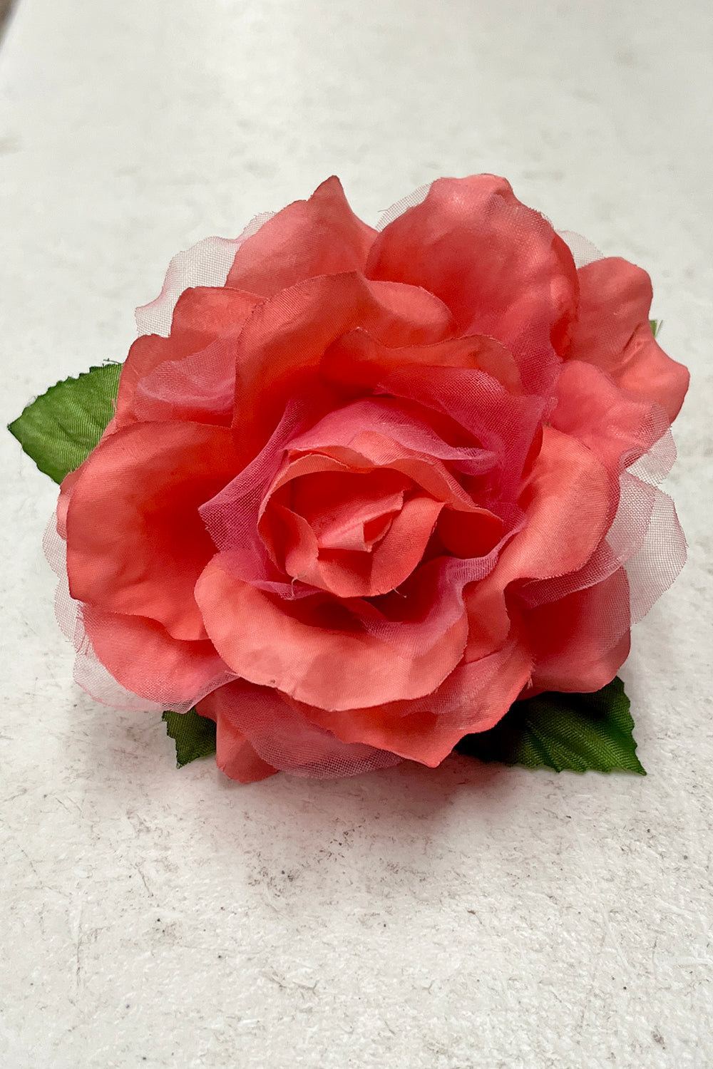 Colorful fabric faux flowers from Kid's Dream accessories pack, featuring coral-colored floral accents.