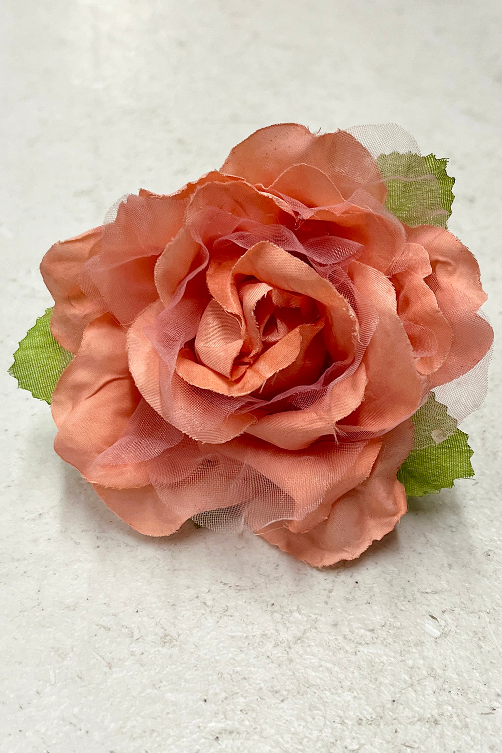 Peach-colored fabric faux flowers in various styles, ideal as accessories, by Kid's Dream.