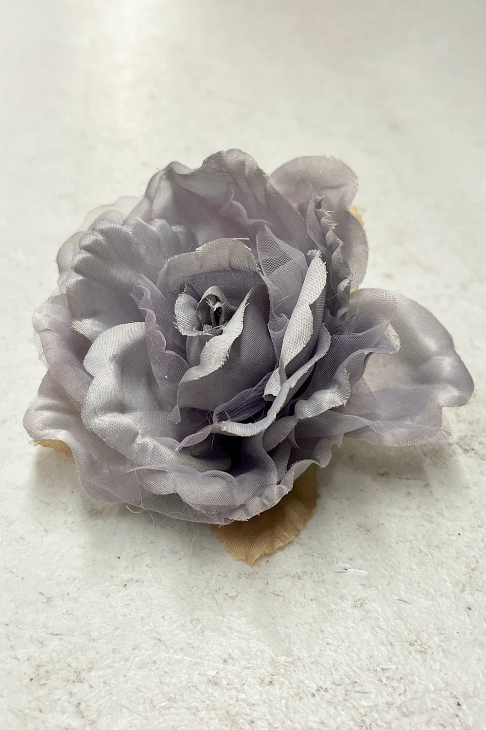 Silver fabric faux flowers from Kid's Dream accessories collection, featuring a variety of single blooms and packs.