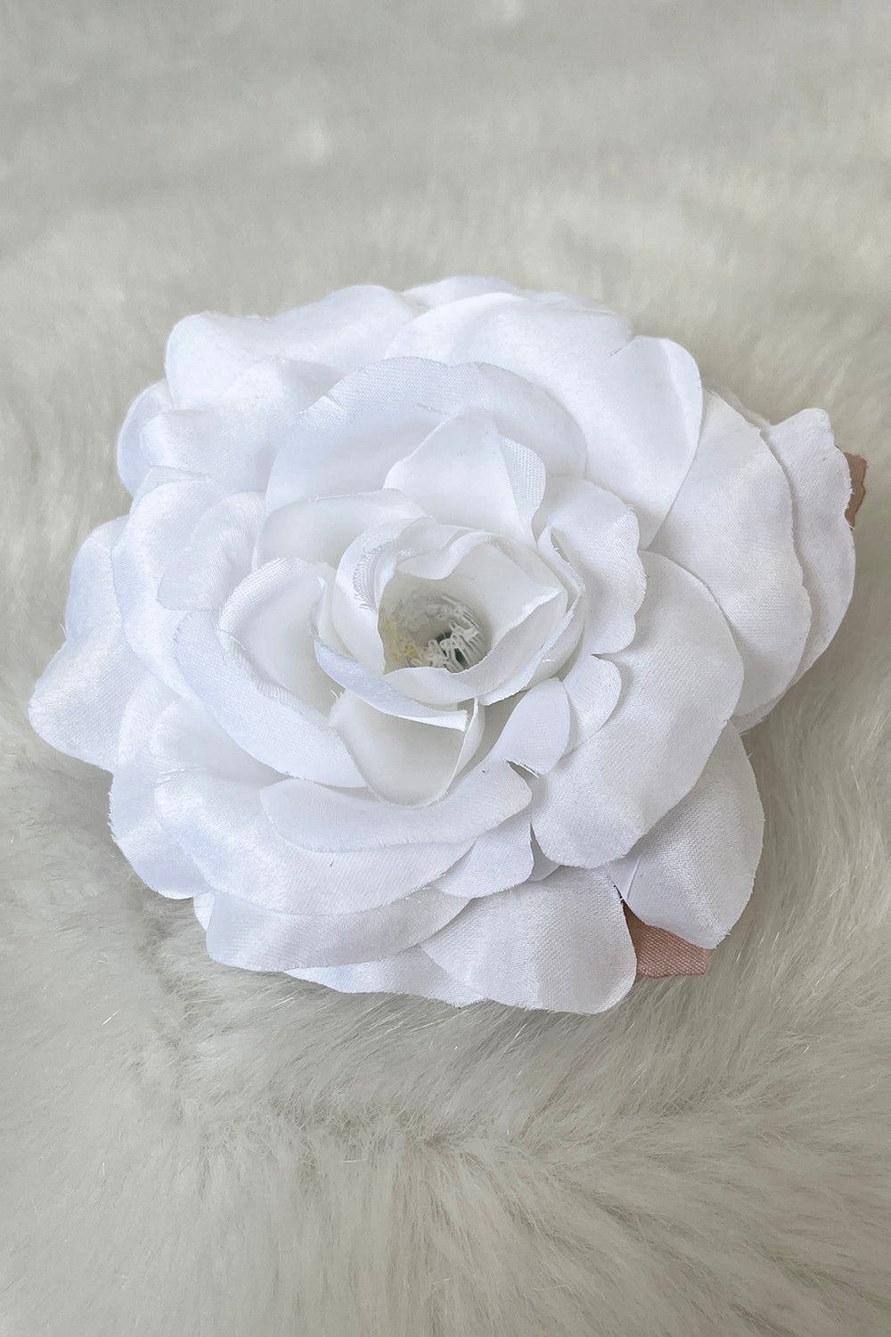Assorted fabric faux flowers in white, used as accessories, arranged in packs and singles by Kid's Dream.
