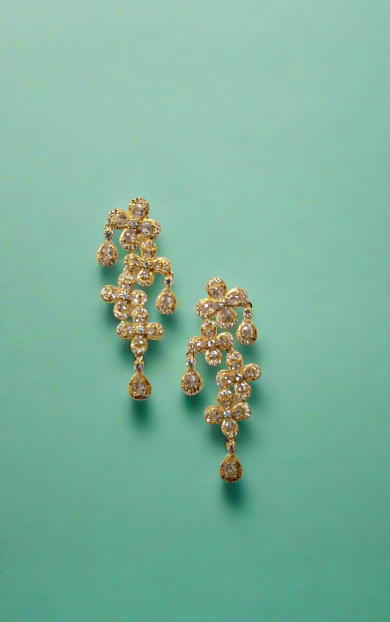 Calla Collection TR-11051 earrings featuring elegant gold hoops with intricate detailing and small gemstone accents.