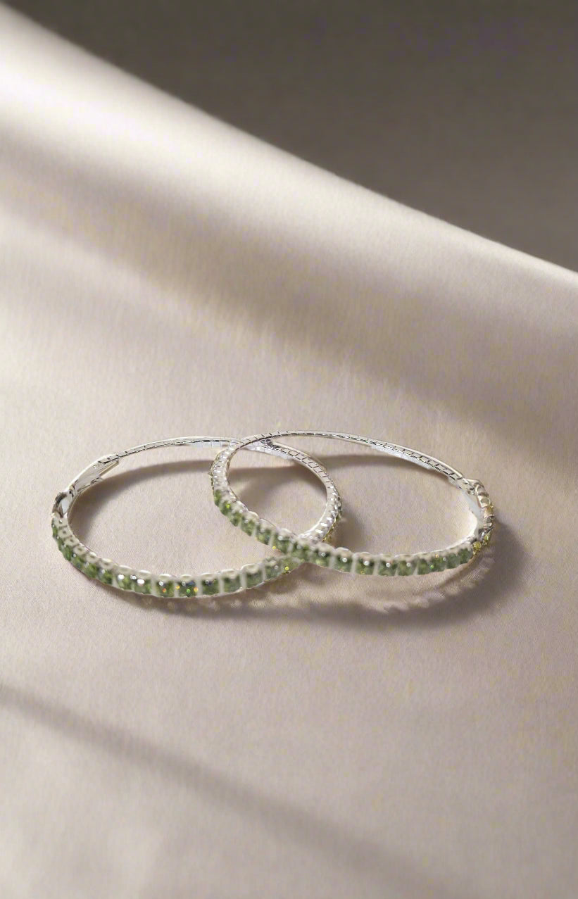 Calla Collection earrings, elegant fashionista hook earrings featuring a sleek metallic design and modern style.