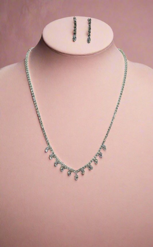 CallaCollection TR-22333 necklace featuring a delicate chain and elegant pendant on a neutral background.