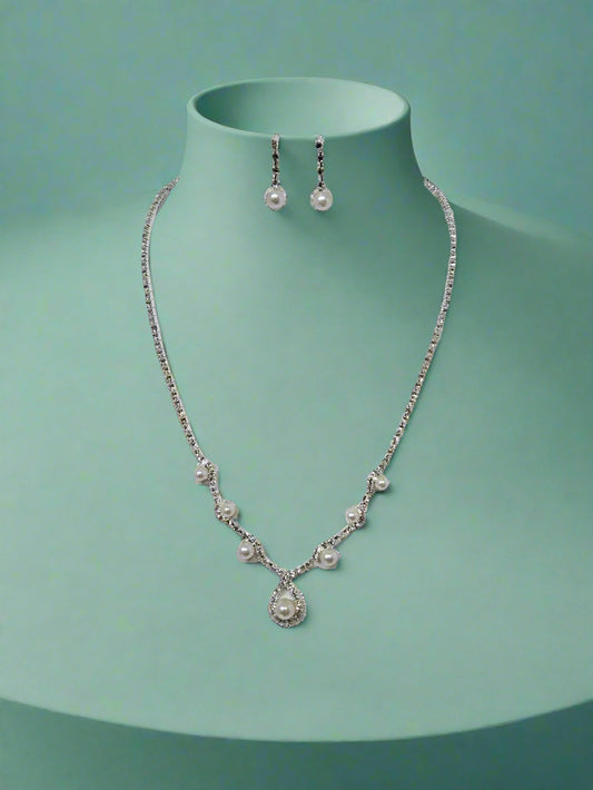 CallaCollection necklace with delicate chain and pendant, featuring elegant jewelry design on a neutral background.