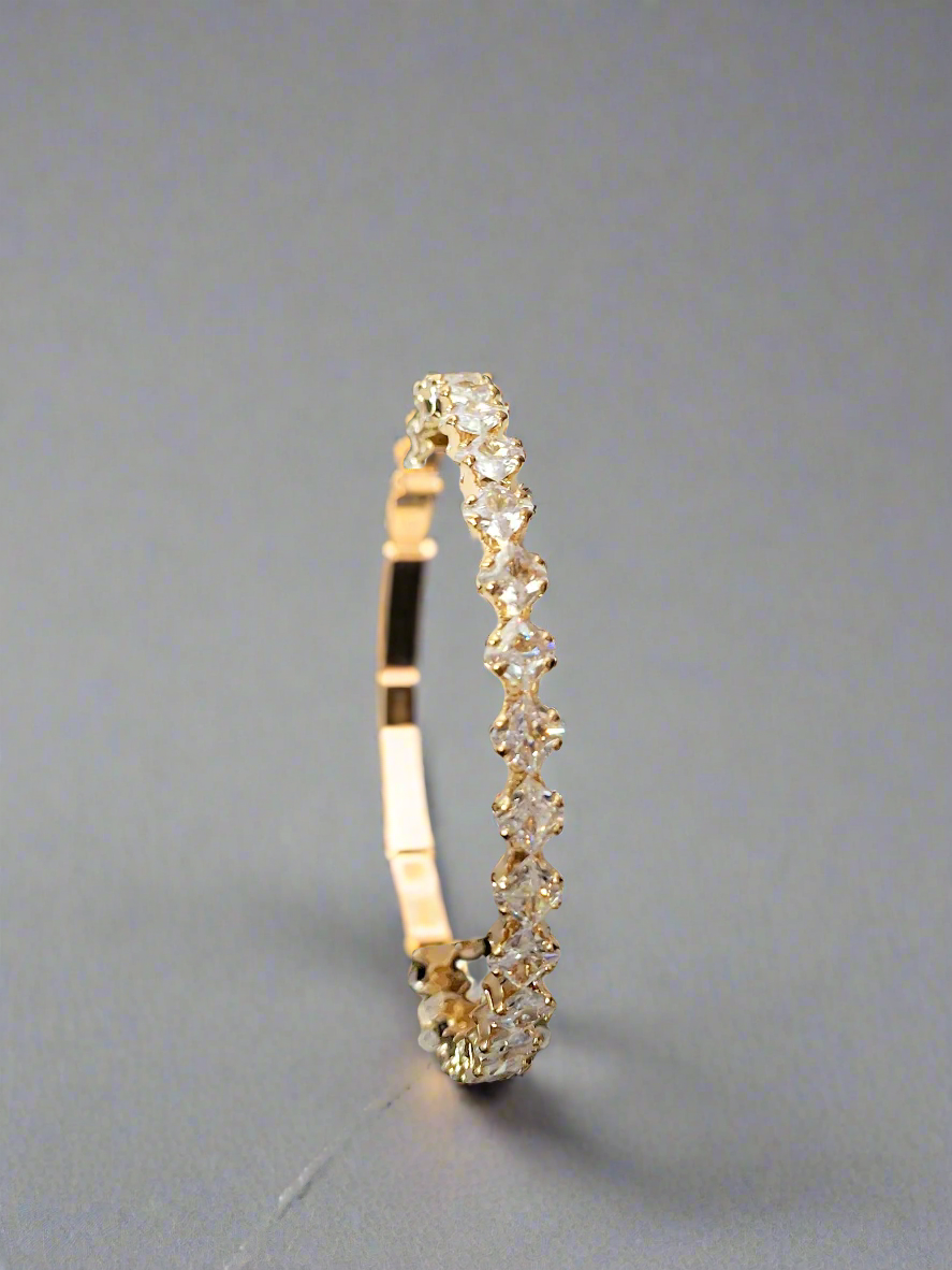 Calla Collection bracelet with intricate metal and bead design, featuring elegant silver and gold-tone accents.