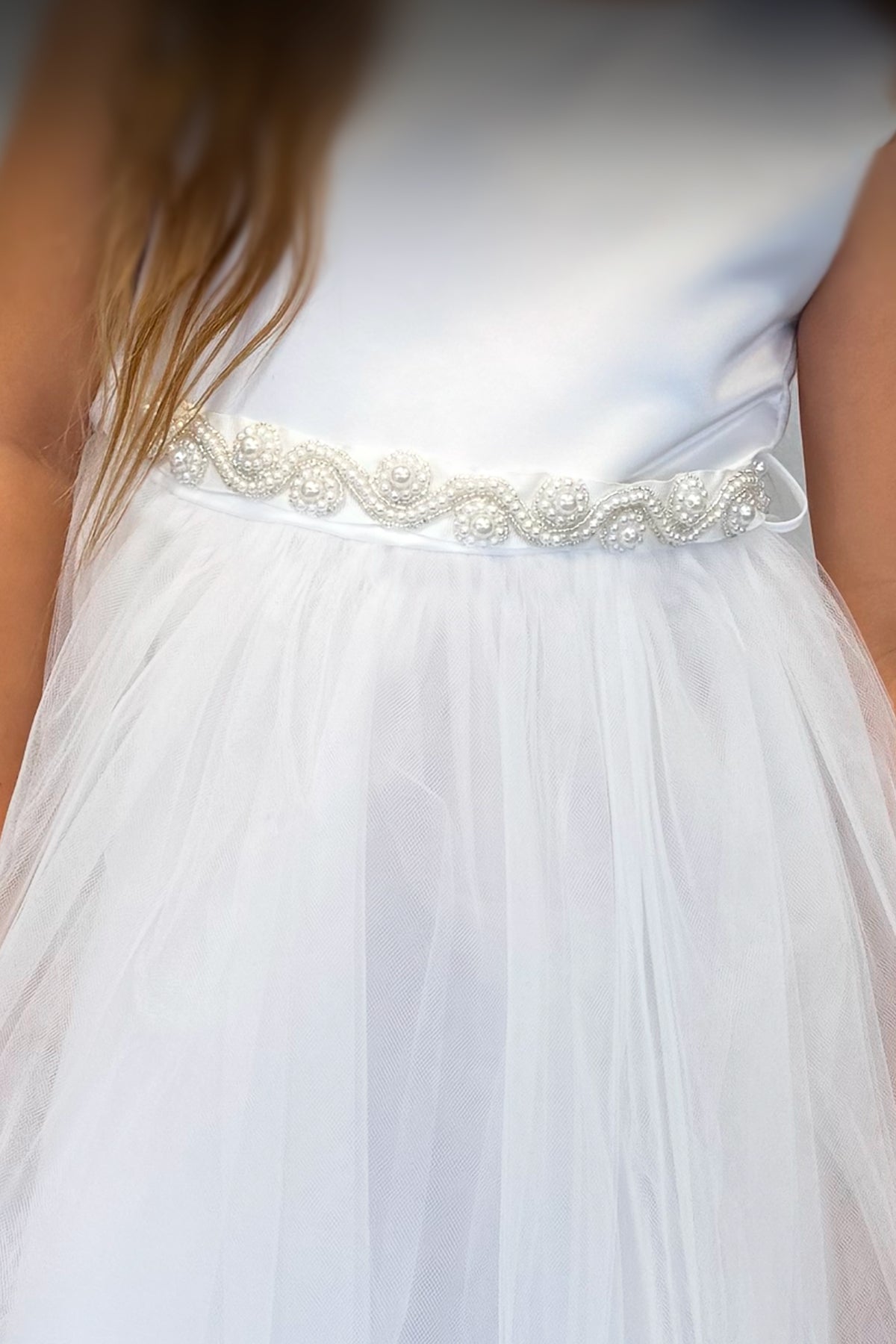 White pearl rhinestone satin and tulle girls' dress by Kid's Dream, featuring elegant embellishments and a flowing design.