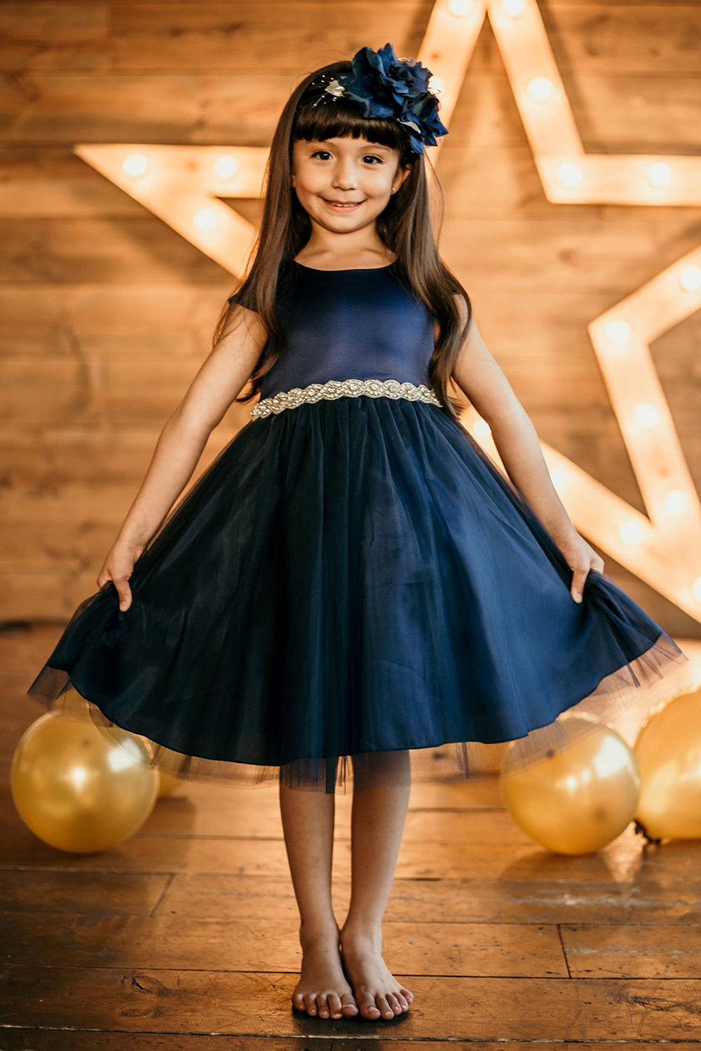 Navy plus size satin and tulle dress with capped sleeves and braided rhinestone trim, by Kid's Dream.