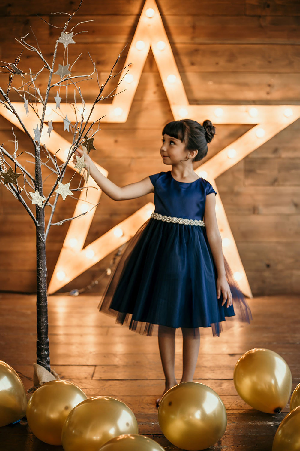 Navy plus size satin and tulle dress with capped sleeves and braided rhinestone trim, by Kid's Dream.