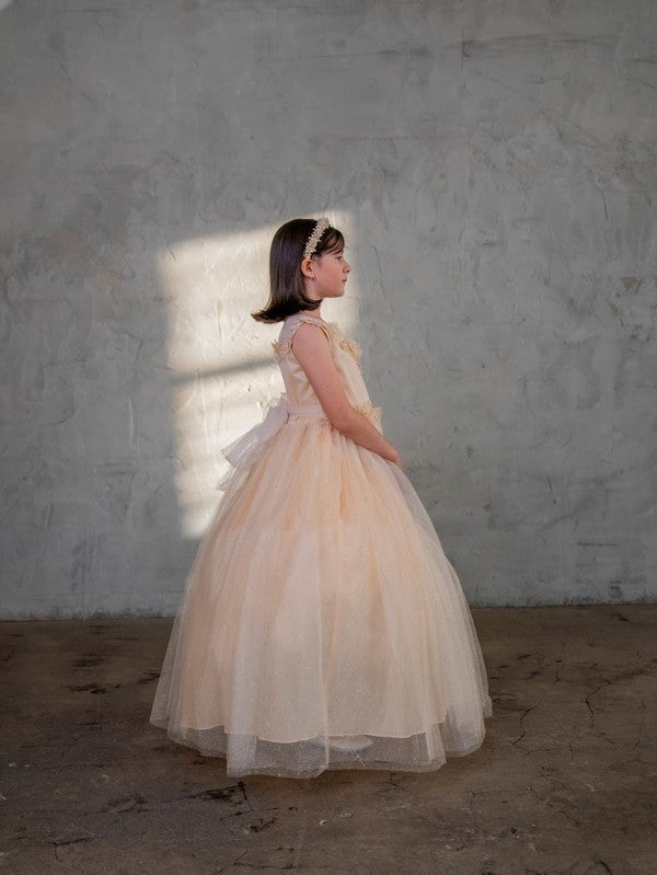 Flowing movement and dramatic cloud-like bounce captured across the cascading soft tulle panels of Calla Collection D-816.