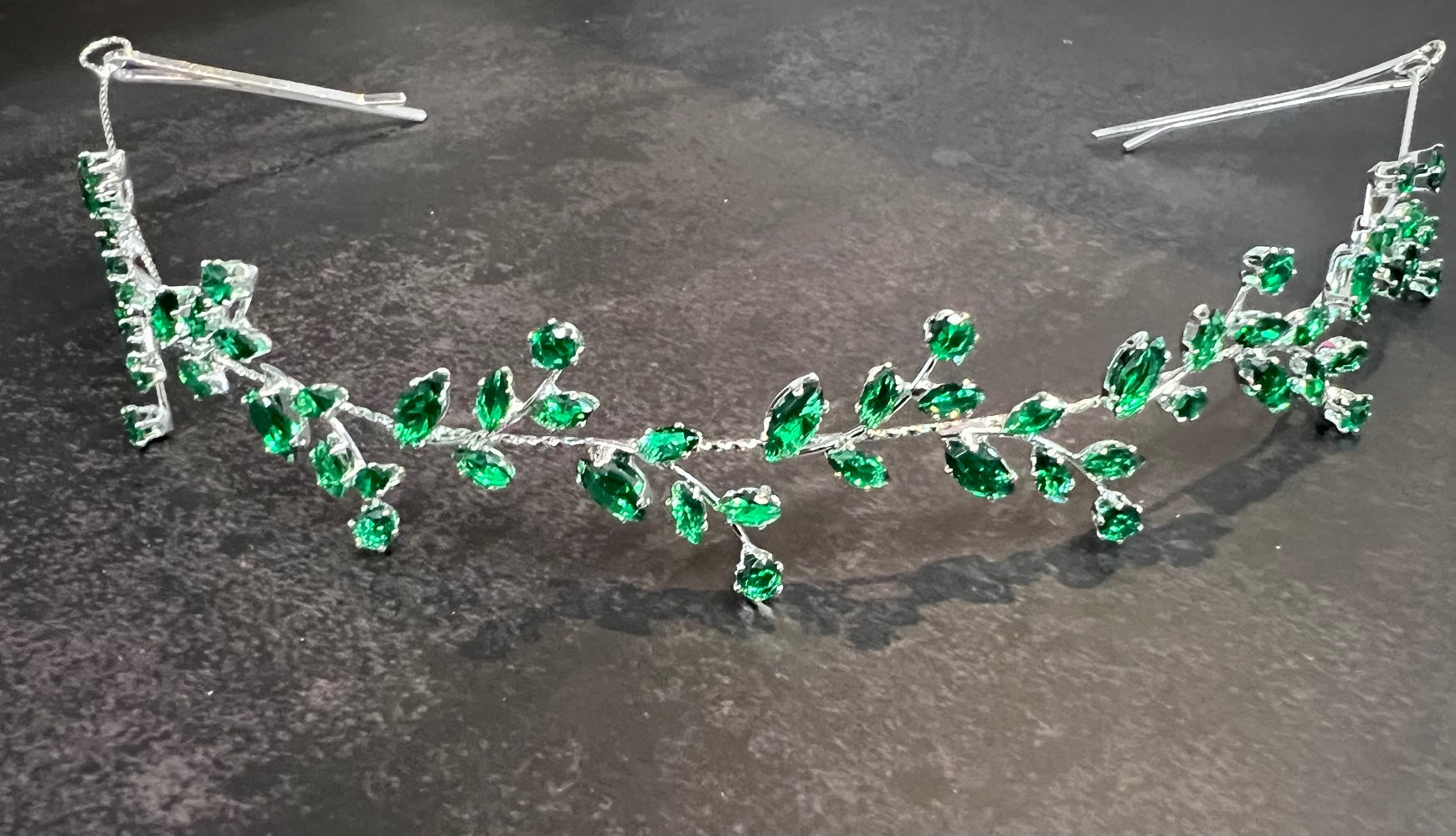 Calla Collection silver hair wrap with emerald accents, innovative secure fit jewelry accessory for stylish hair styling.