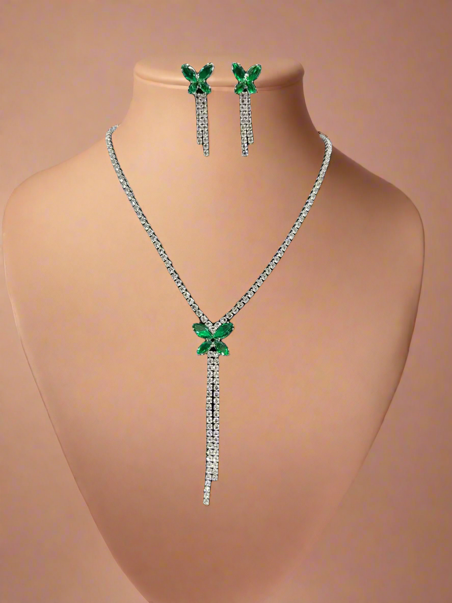 Calla Collection emerald necklace featuring a vibrant green gemstone on a delicate chain, elegant jewelry accessory.