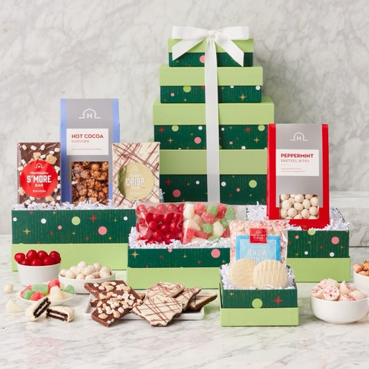 Gourmet sweets gift tower in a decorative basket from GreatArrivals/WineCountry, featuring assorted chocolates and confections.