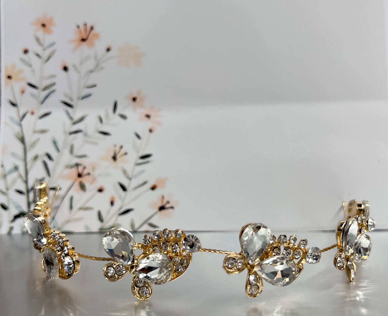 Gold jewelry piece from Calla Collection's TR-636 collection, featuring intricate design and shiny gold finish.