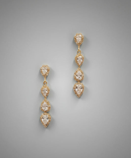 Gold Callacollection earrings with elegant floral design, featuring delicate petal-shaped details and shiny finish.