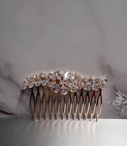 Gold jewelry piece from CALLAcollection, showcasing intricate design and craftsmanship, suitable for elegant accessorizing.