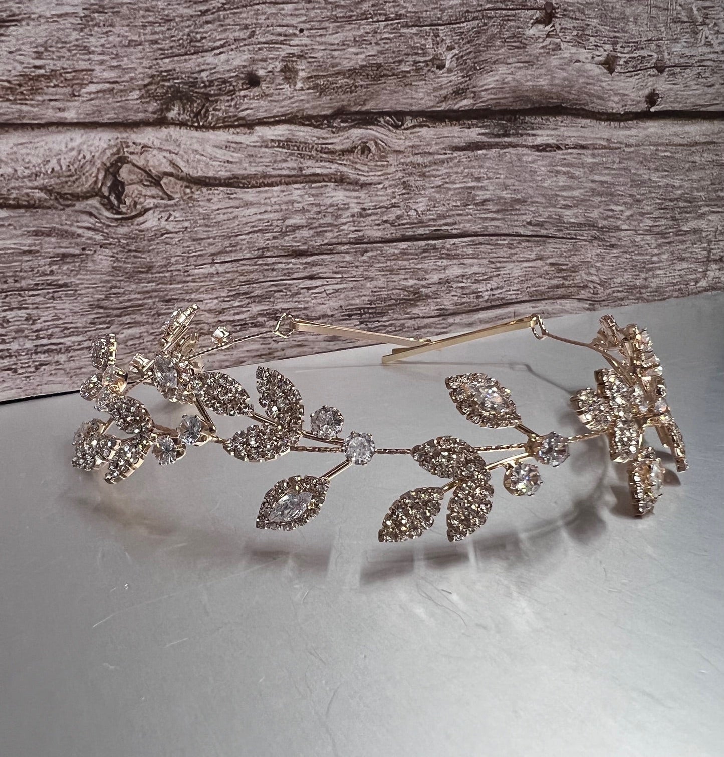 Gold jewelry piece from Calla Collection, featuring intricate design and shiny finish, showcasing fine craftsmanship.
