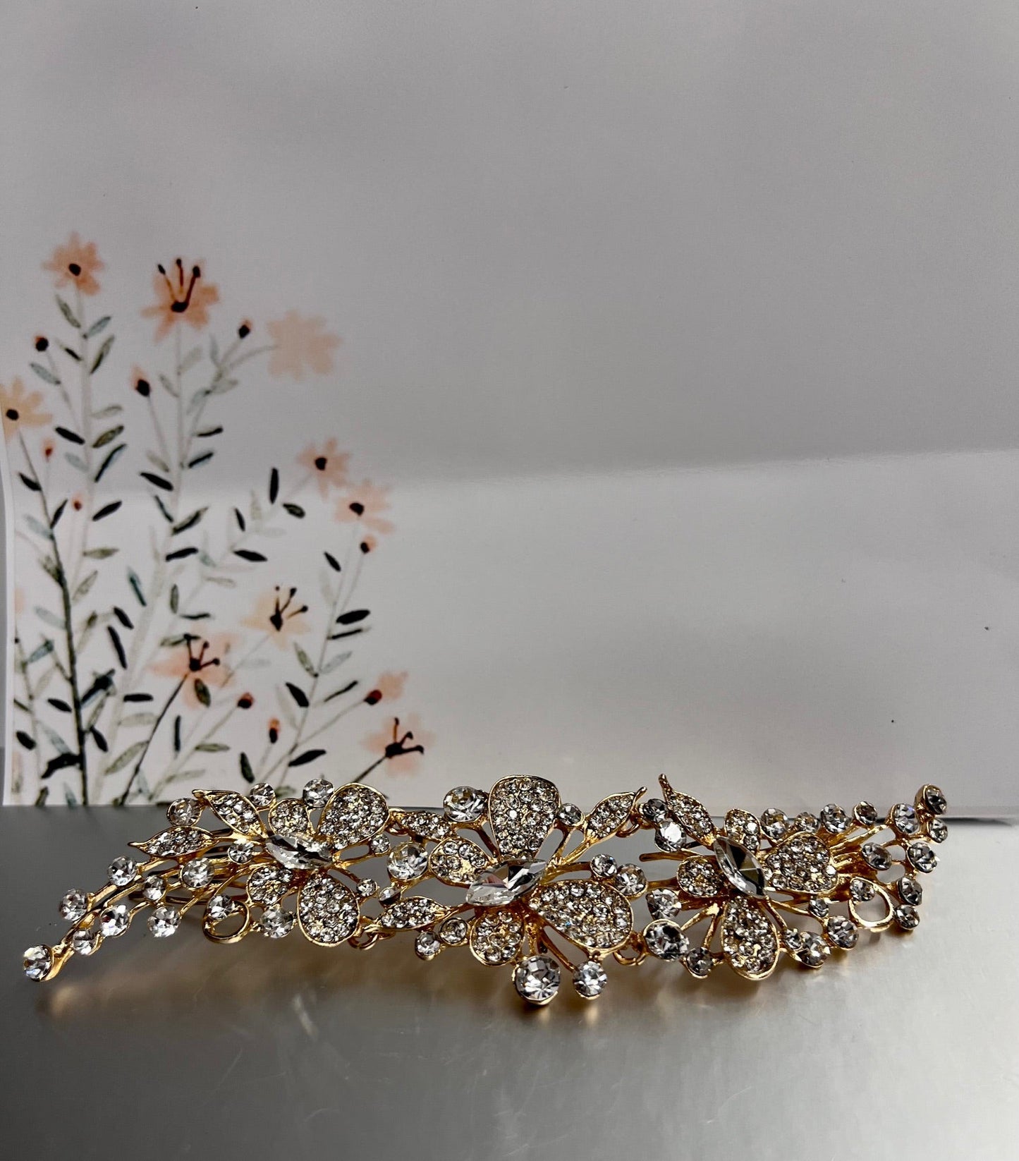 Gold jewelry piece from Calla Collection's TR-628 collection, featuring intricate design and shining finish.