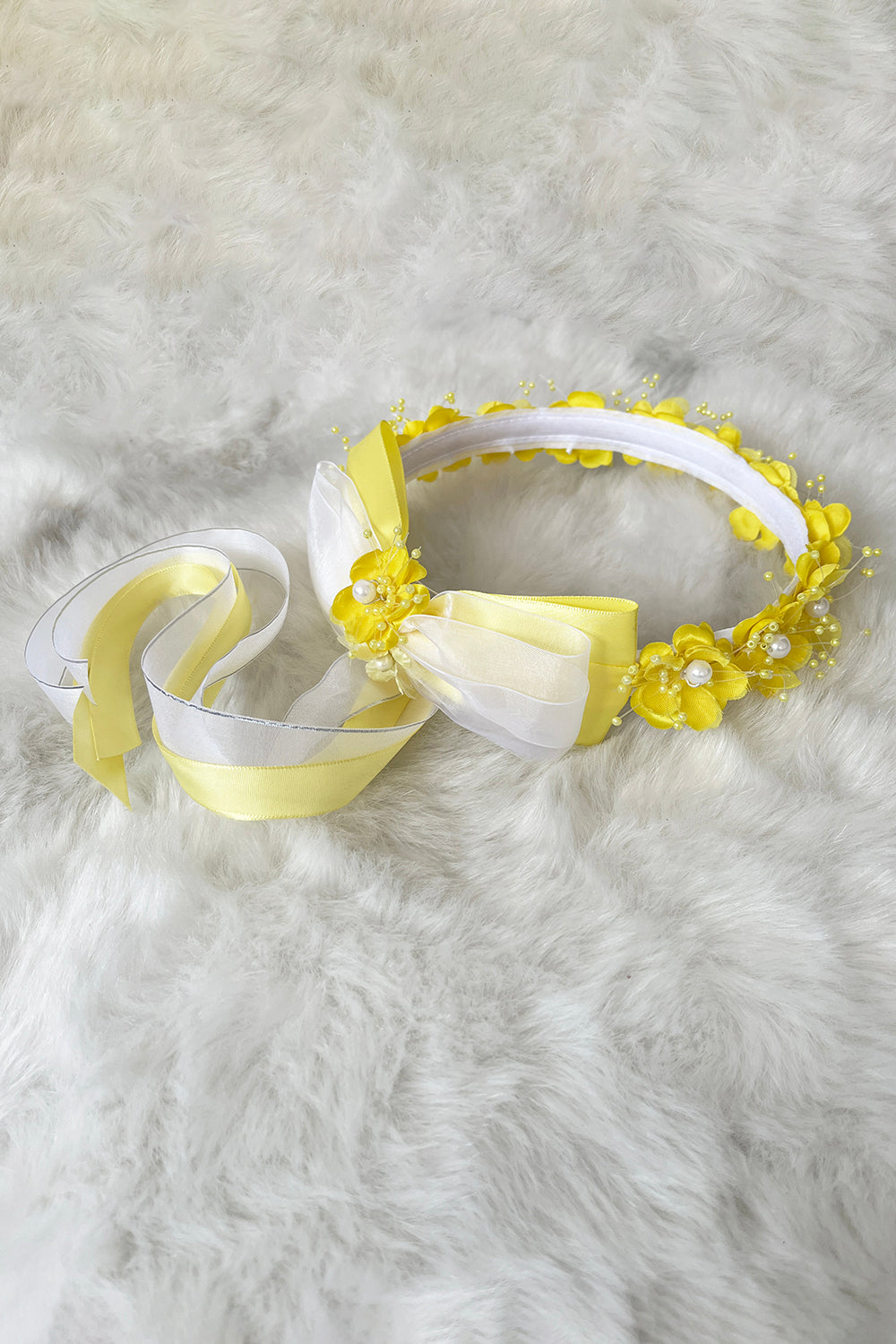 Yellow flower crown with embedded gems and flowing ribbons, designed for children by Kid's Dream.