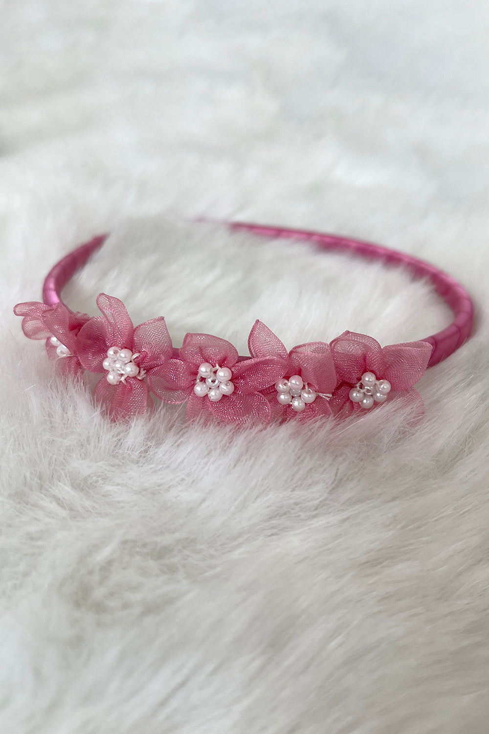 Dusty rose organza flower headband with pearl detailing, a charming accessory for kids by Kid's Dream.