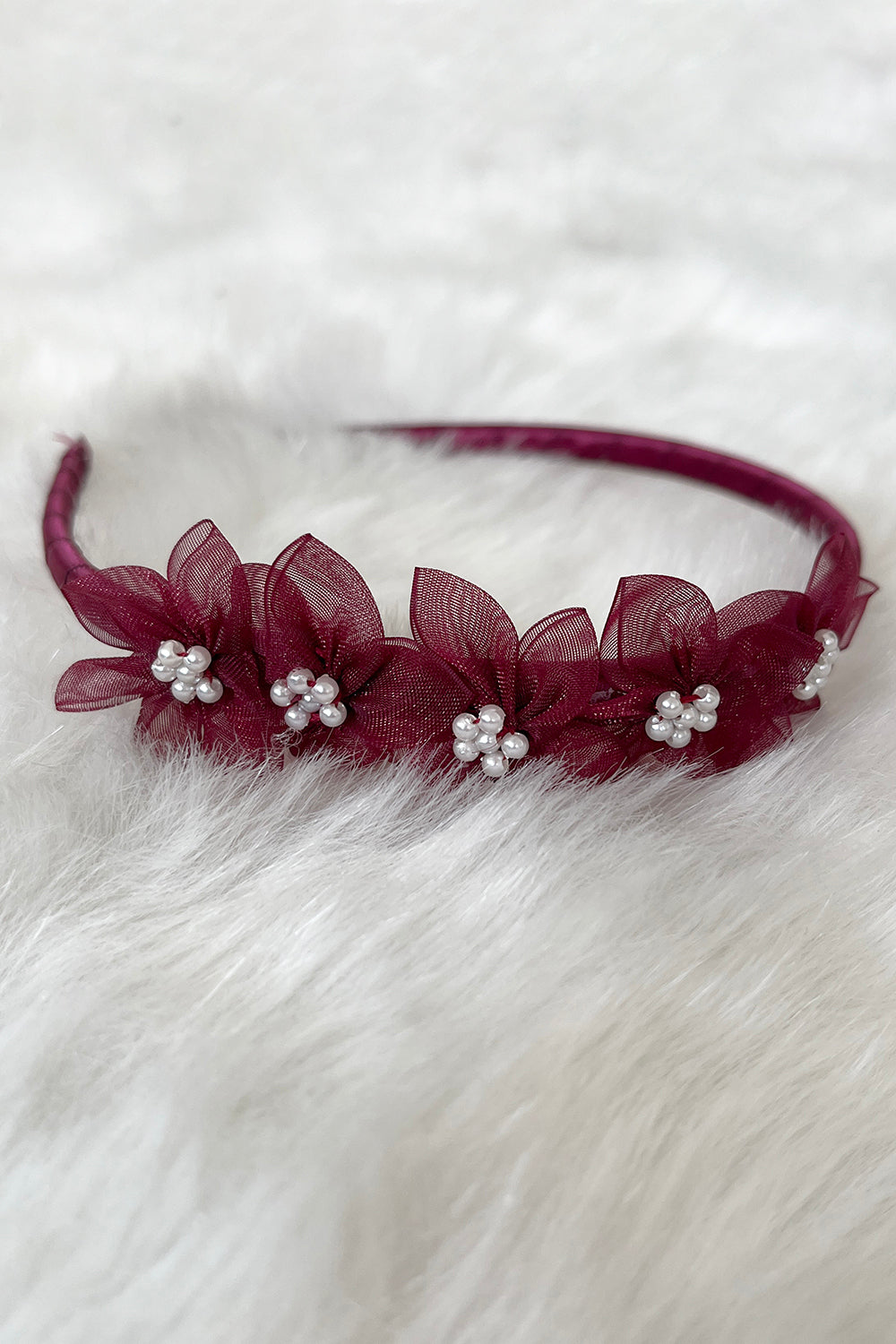 Wine-colored organza flower headband with pearl accents, perfect for accessories and special occasions.
