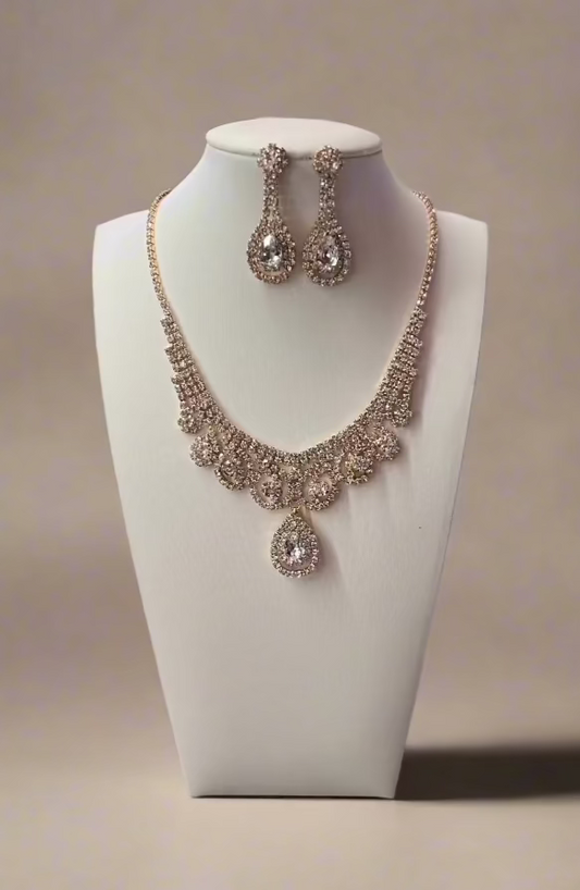 Elegant Calla Collection necklace set featuring intricate design and matching earrings, perfect for traditional or festive occasions.