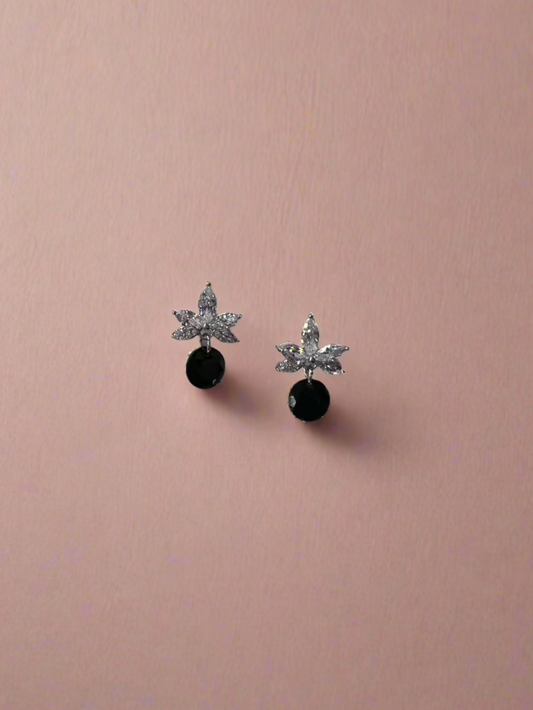 CALLAcollection TR-027 accessory, small black rubber clip or connector, close-up view with textured surface and metal pin detail.