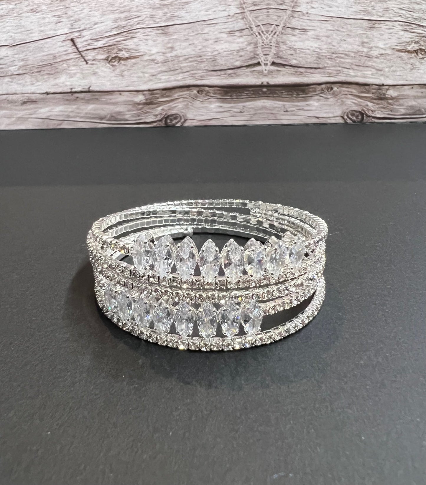 Versatile multi-layer fashion bracelet from CALLAcollection3 with intricate metal designs and diverse chain styles.