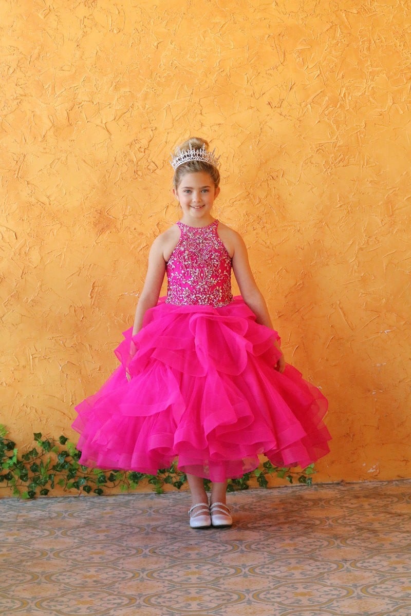 Detailed beadwork on magenta high neck bodice of Calla Collection KY217 pageant dress.