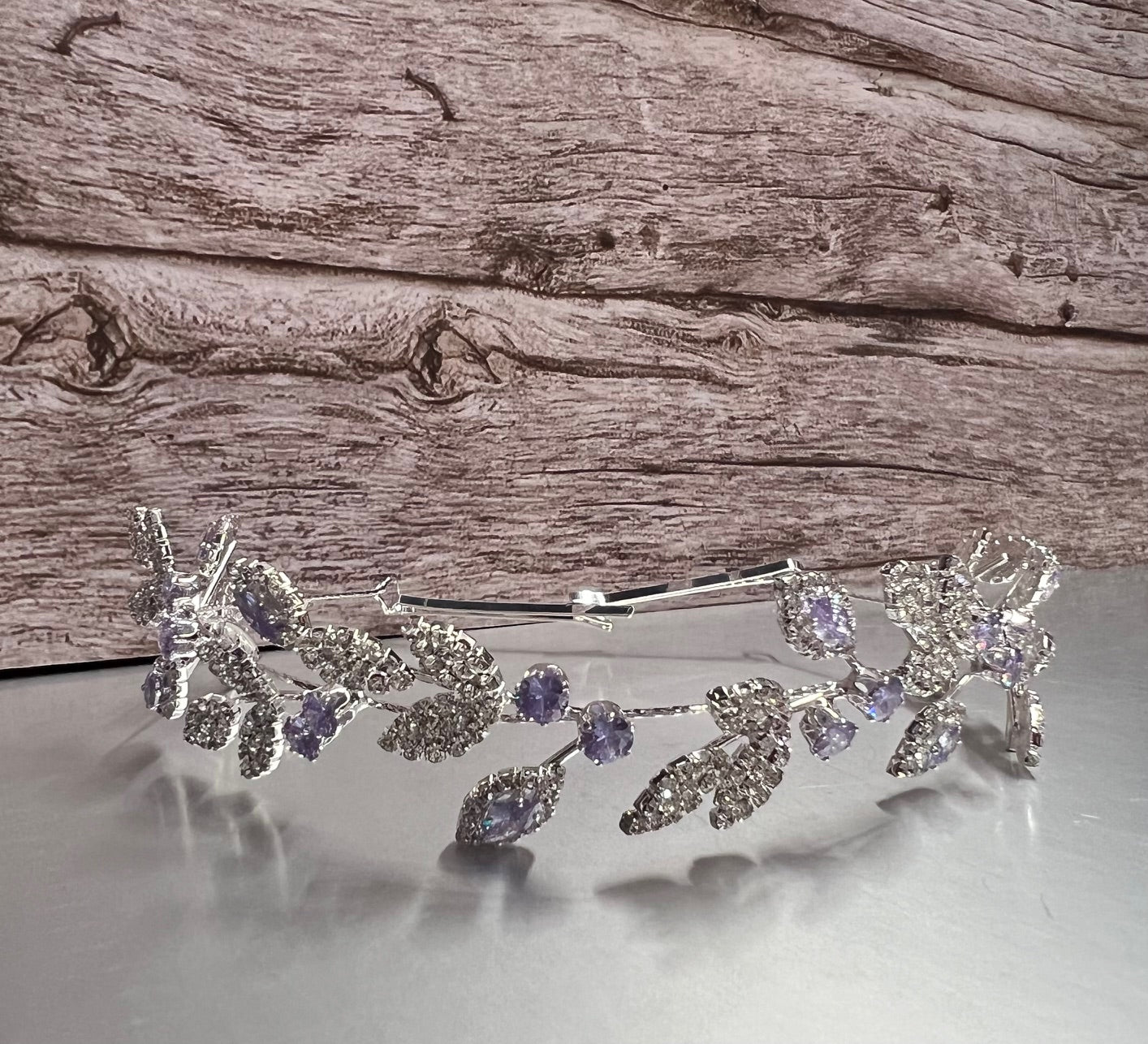 Silver jewelry piece with lilac accents from Calla Collection, featuring intricate design and elegant craftsmanship.
