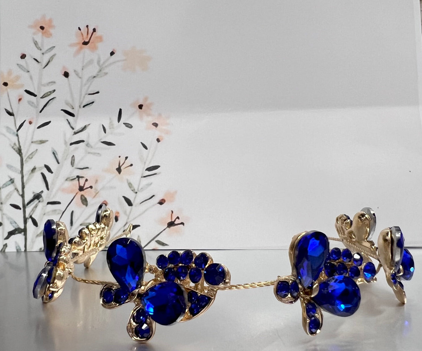 Calla Collection TR-636 royal blue and gold jewelry piece with intricate design, close-up shot showcasing its detailed craftsmanship.