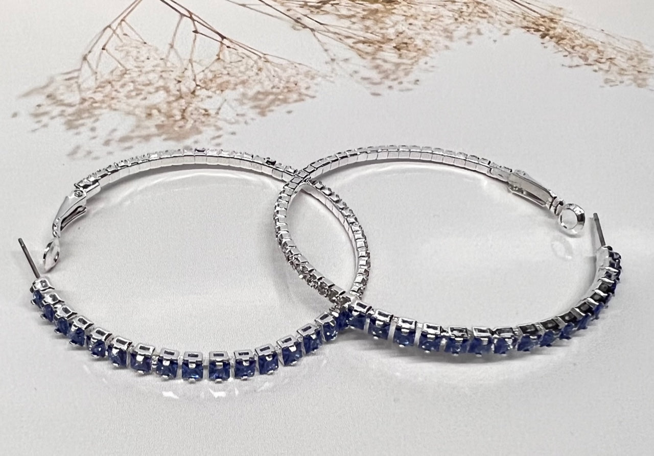 Royal blue Calla Collection earrings with elegant hook design, fashionista style, showcasing a sleek, vibrant jewelry piece.