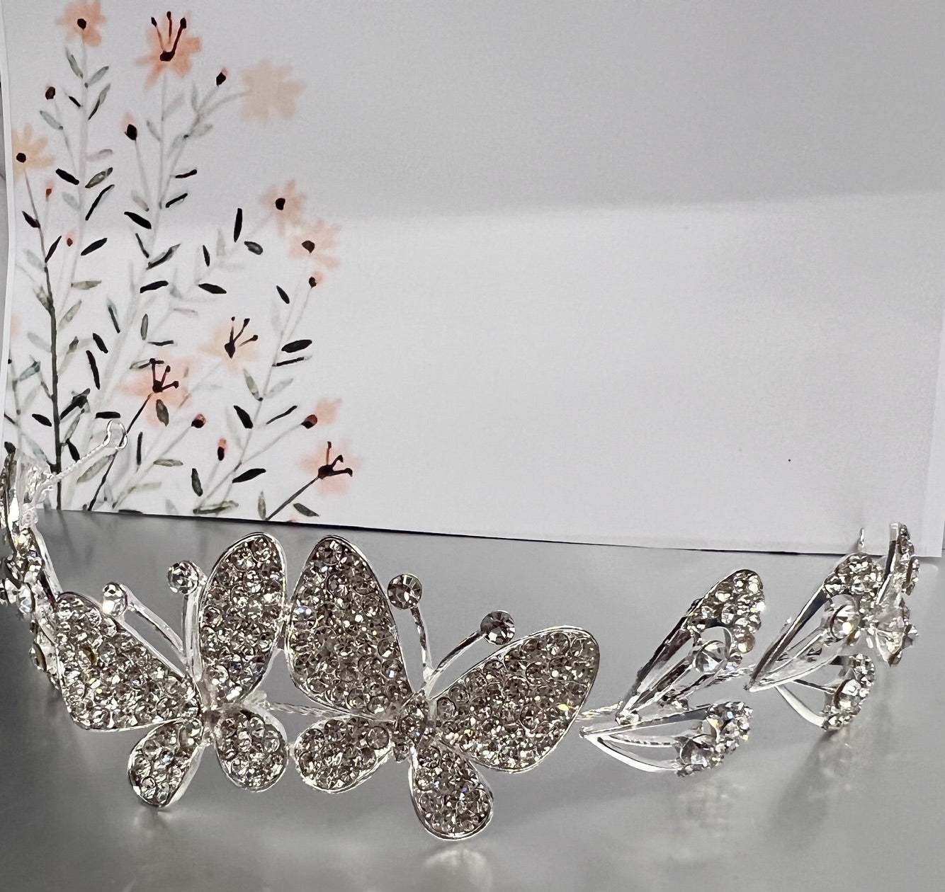 Silver jewelry piece from Calla Collection, style TR-631, showcasing intricate design and shiny silver finish.