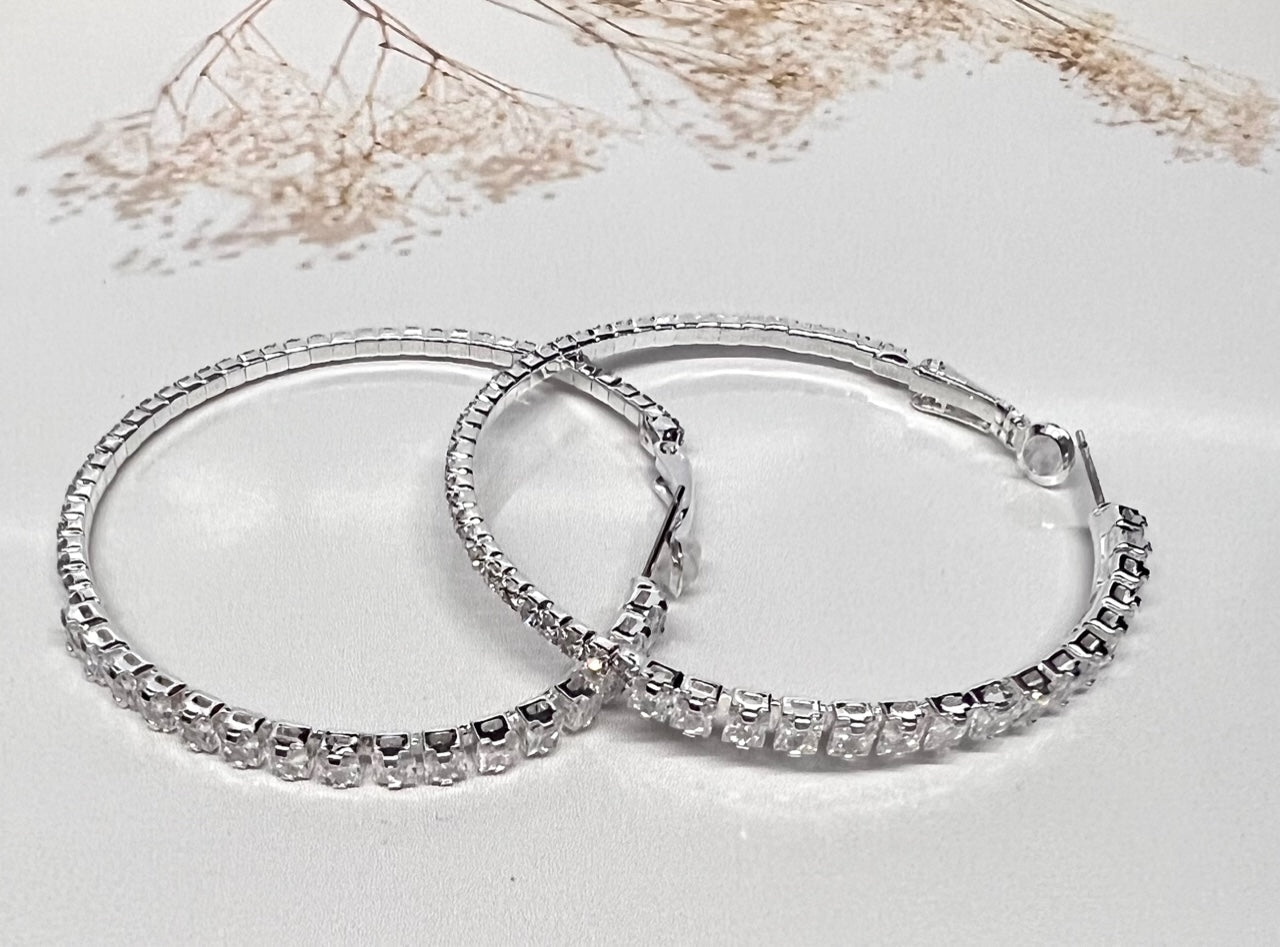 Silver Calla Collection earrings with elegant hook design, stylish fashionista jewelry accessory.