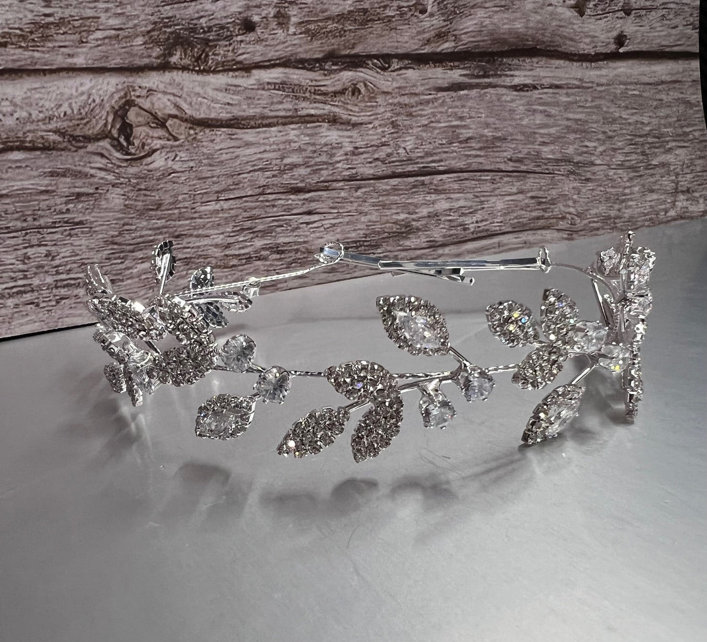 Silver jewelry piece from Calla Collection, featuring intricate design and polished finish, shown on a neutral background.