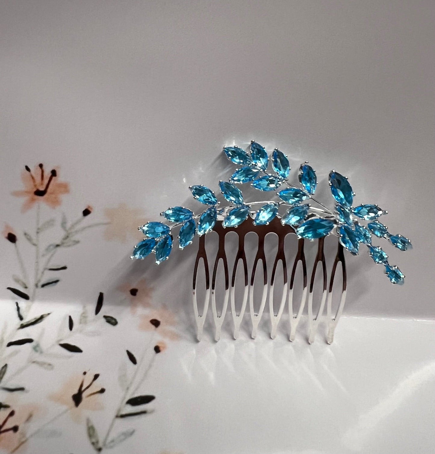 Calla Collection turquoise jewelry piece featuring a vibrant turquoise stone set in silver, showcasing intricate craftsmanship.