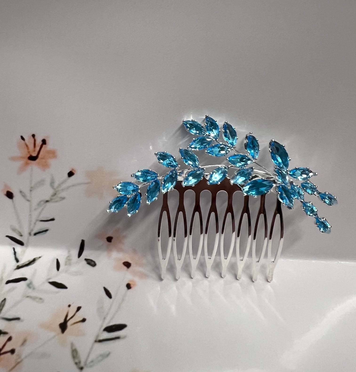 Calla Collection turquoise jewelry piece featuring a vibrant turquoise stone set in silver, showcasing intricate craftsmanship.