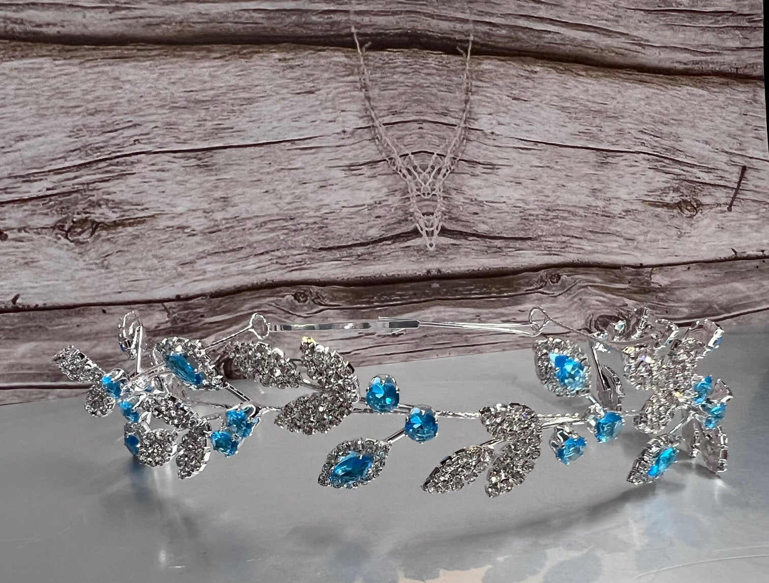 Calla Collection turquoise jewelry piece, showcasing intricate details and vibrant blue-green color in a close-up shot.