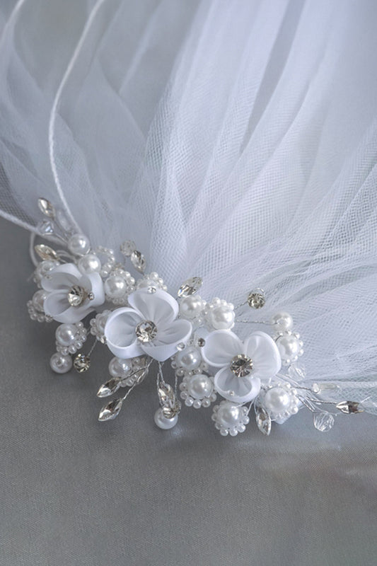 Child's comb veil with delicate pearl and rhinestone accents, elegant accessory for special occasions by Kid's Dream.