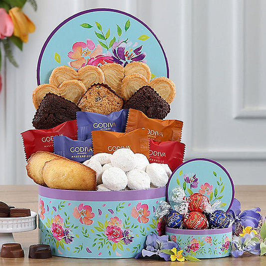 Colorful floral-themed sweets gift basket from GreatArrivals/WineCountry, featuring an assortment of confections in a decorative basket.
