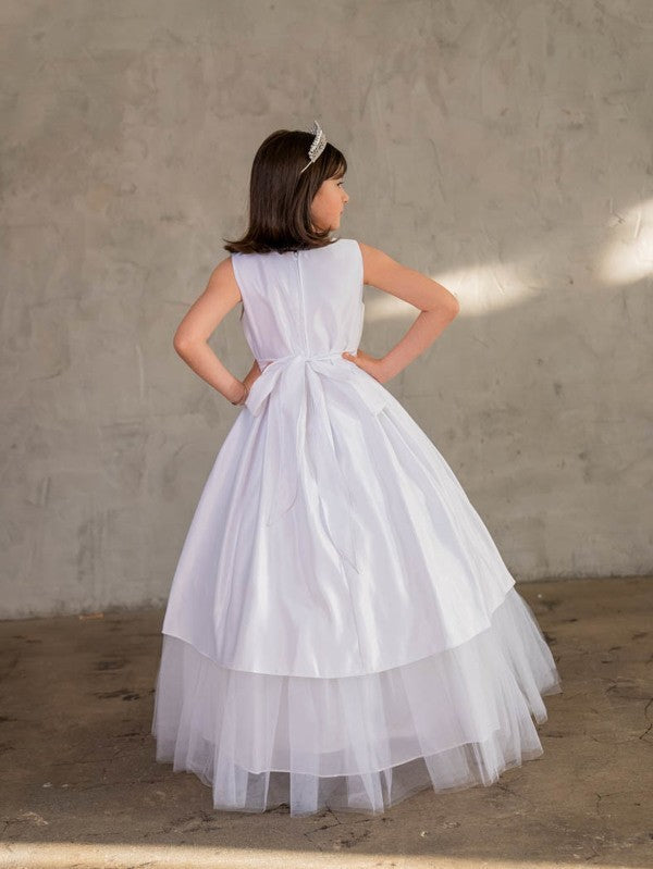 Back view of Calla Collection D-824 communion dress showing the structured bodice and voluminous layered tulle skirt